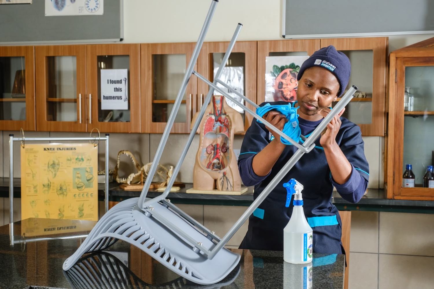 Bidvest Prestige colleague cleaning a chair